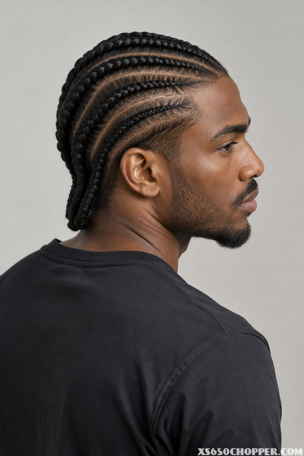 A man poses against a plain background.