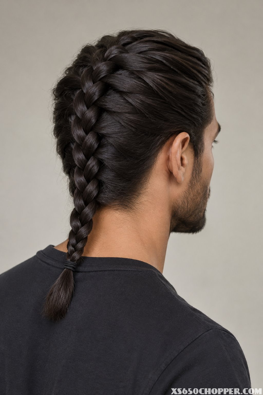 A man with one braid in his hair.