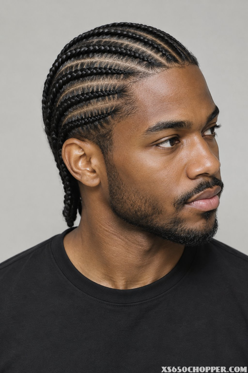 A man poses against a plain background.