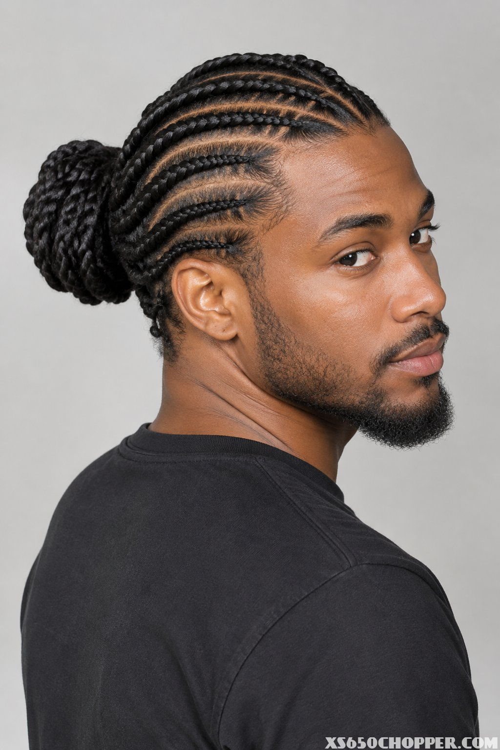 A man poses against a plain background.