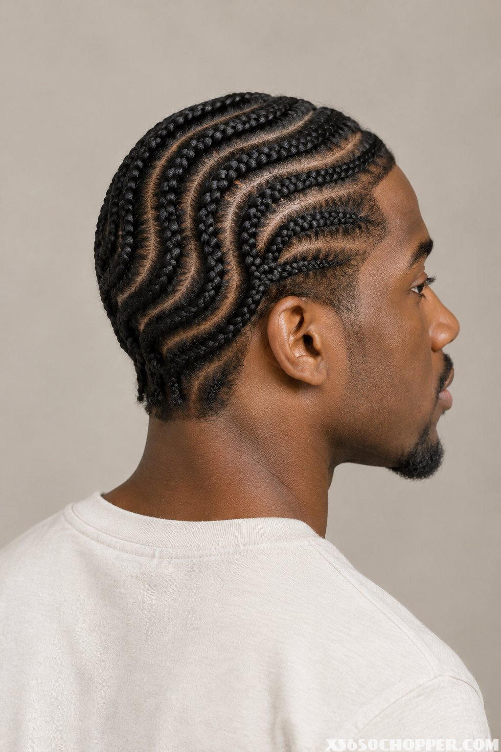 A man poses against a plain background.
